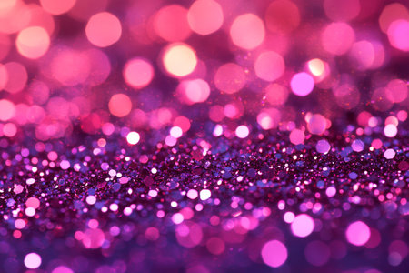 Small round pieces of glitter in various shades of purple and pink are scattered on a flat surface, creating a festive atmosphere suitable for celebrations or parties.の素材