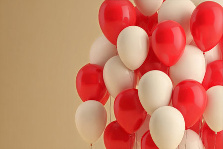 A bunch of vibrant red and white balloons floats gracefully against a soft, neutral background, perfect for parties, gatherings, and special occasions..の素材