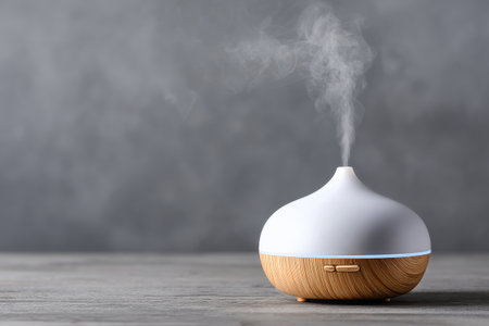 A stylish diffuser gently releases steam into the air, creating a calming atmosphere in a modern indoor setting. The light wood and white design enhance the peaceful vibe. AI Generativeの素材