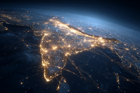 Bright lights outline Indias cities and roads at night, revealing the extensive urban development and dense population.の素材