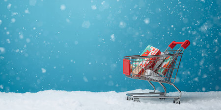 A shopping cart filled with products, including a milk bottle and festive decorations, is set against a blue background with falling snowflakes, evoking a seasonal vibe.の素材