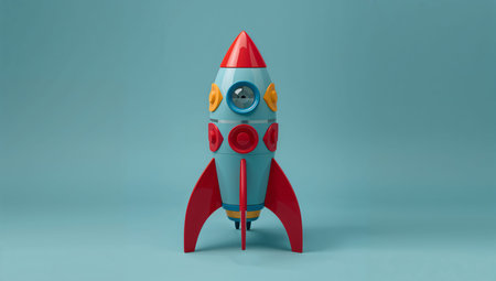 A colorful rocket model displays unique art and design features in a studio. The display highlights different patterns and colors used in its creation.の素材