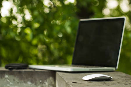 Laptop sunny summer day in the urban environment.の写真素材