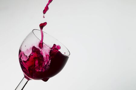 Wine pouring into a glass, studio lighting, Macroの写真素材