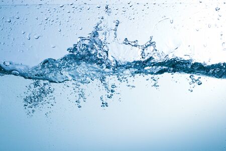 Flowing water, drops, sprays, splashes on a neutral background, studio light, abstraction,...