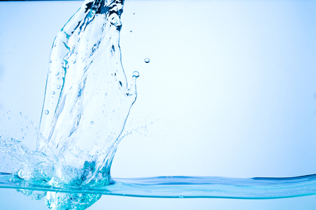 Flowing water, drops, sprays, splashes on a neutral backgroundの写真素材