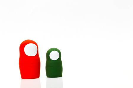 Wooden multi-colored toy nuts on white background, studio lightの写真素材