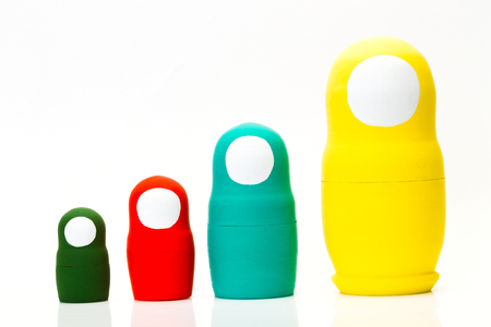 Wooden multi-colored toy nuts on white background, studio lightの写真素材