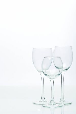 Three glasses for wine on a white background, studio lightの写真素材