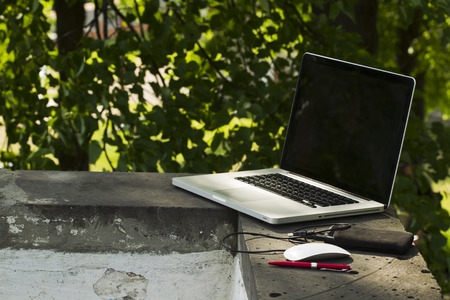 Laptop sunny summer day in the urban environment.の写真素材
