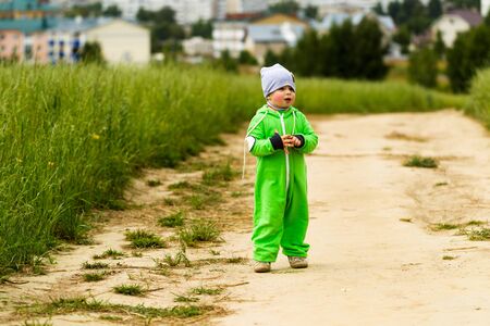 Emotional child on a walk outside the cityの写真素材