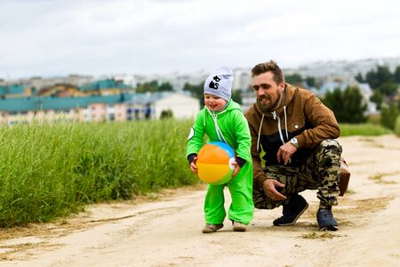 Young parents with a small child on a country walk