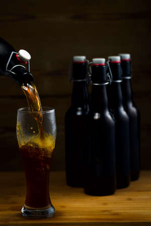 Beer glases on the background of wooden boards studio lightの写真素材