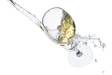 Drops of spray streams of wine and a glass on a white backgroundの写真素材