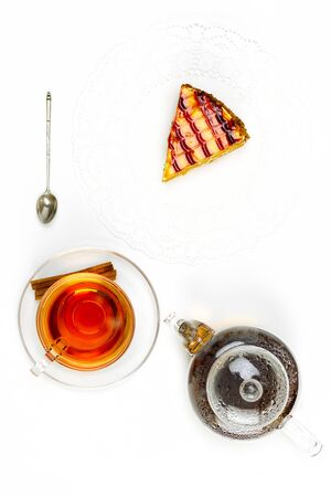 Transparent teapot, glass cup, spoon on white background, top viewの写真素材
