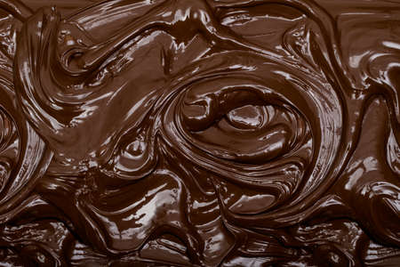 Chocolate dark liquid texture close up full frame food background