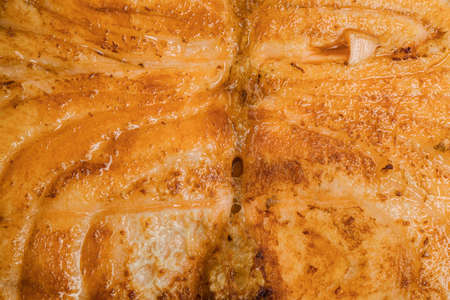 Salmon red fish steak fried close-up texture food background full frameの写真素材