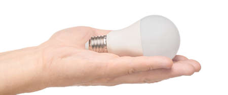 LED light bulb (lamp) in hand on isolated white backgroundの写真素材