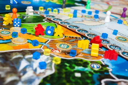 Board game concept- many board game field figures, meeple, dice and coinsの写真素材