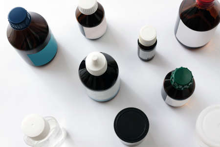 Medications in glass bottles. Medical concept background closeup top viewの写真素材