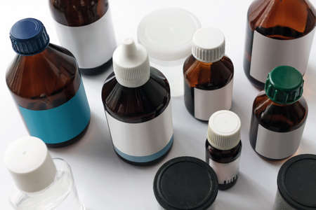 Medications in glass bottles. Medical concept background closeup top viewの写真素材