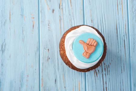 Positive capkake on a blue wooden tableの写真素材