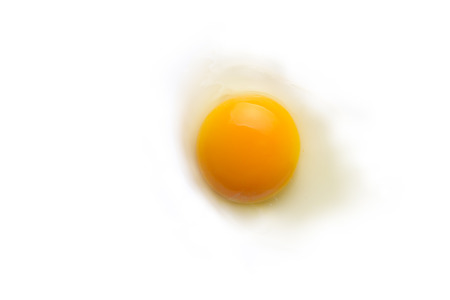 Raw Egg yolk on white isolated background