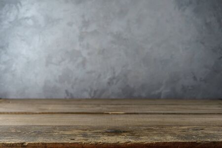 Empty table top on concrete wall background