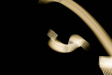 Golden light texture isolated on black background - closeupの写真素材