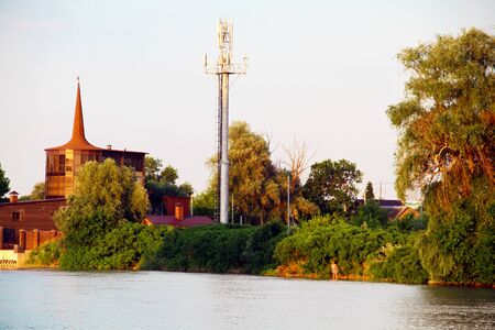View of the cozy bungalow on the river bankの写真素材