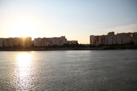 view of the evening city on the riverの写真素材