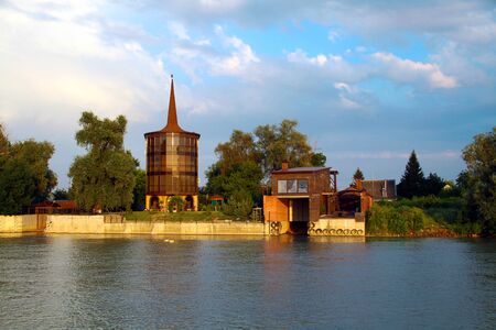 View of the cozy bungalow on the river bankの写真素材
