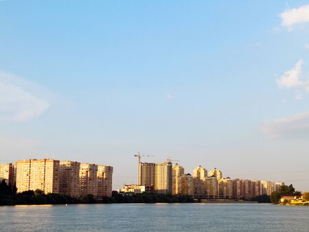 view of the evening city on the riverの写真素材