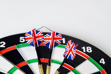 A game of darts with three flags of England on a white background