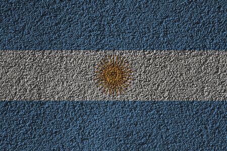 Argentina flag on a background wall texture. The concept of design solutions.の写真素材