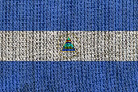 Nicaragua flag on the background texture. Concept for designer solutions.の写真素材