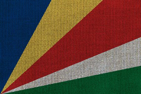 Seychelles flag on the background texture. Concept for designer solutions.の写真素材