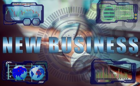 Hands of a businessman using a laptop with smart phone and futuristic holographic screen in the graphs of the exchange rate and the inscription:  NEW BUSINESSの写真素材