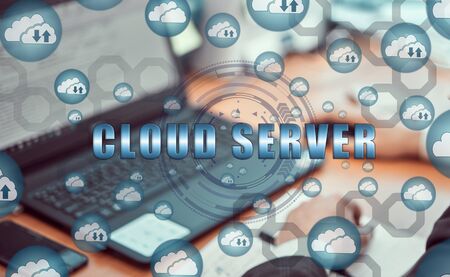 Cloud storage icons flying from the center. Hands of a businessman using a laptop with a smartphone...