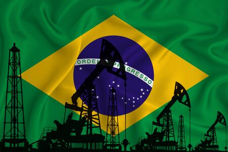Silhouette of drilling rigs and oil derricks on the background of the flag of Brazil. Oil and gas industry. The concept of oil fields and oil companies.の写真素材