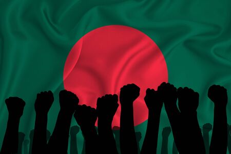 Silhouette of raised arms and clenched fists on the background of the flag of Bangladesh. The concept of power, power, conflict. With place for your text.の写真素材