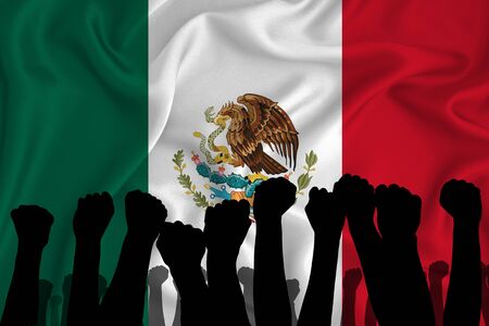 Silhouette of raised arms and clenched fists on the background of the flag of Mexico. The concept of power, power, conflict. With place for your text.の写真素材