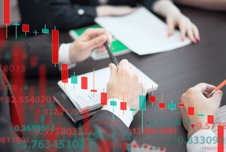 A group of people analyze the stock market. Business and finance, technology, cryptocurrency, stock crisis, falling prices, downward chart, or Forex chart, the collapse of economy.の写真素材