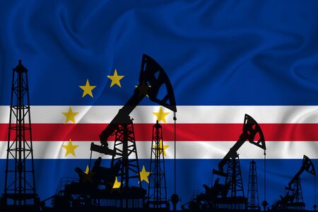 Developing Flag of Cabo Verde. Silhouette of drilling rigs and oil rigs on a flag background. Oil and gas industry. The concept of oil fields and gas and oil companies. 3D rendering.の写真素材