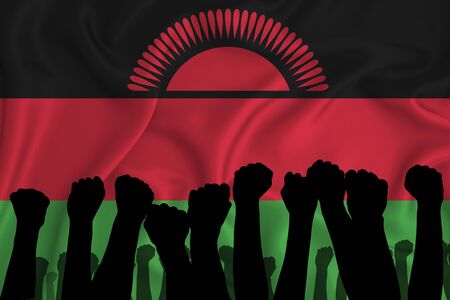 Silhouette of raised arms and clenched fists on the background of the flag of Malawi. The concept of power,  conflict. With place for your text. 3D renderingの写真素材