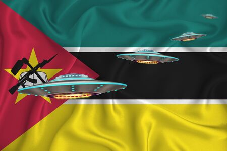 Waving flag of Mozambique. UFO group on the background of the flag. UFO news concept in the country. 3D renderingの写真素材