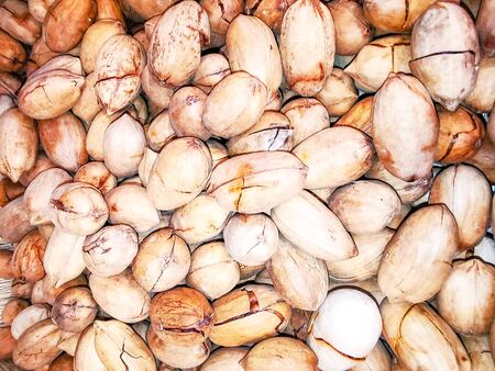 Macro photo of inshell pecans. Closeup of inshell pecans. Agricultural farms. It can be used as a...