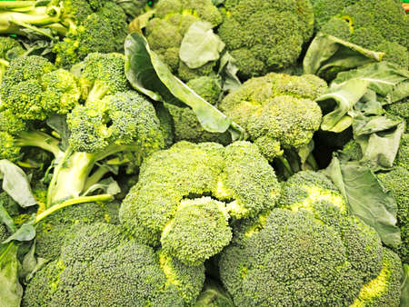 A group of green Brussels sprouts in a supermarket, Brussels sprouts background, Fresh cabbage from a farm field, lots of cabbage in the market square. Healthy food concept.の写真素材