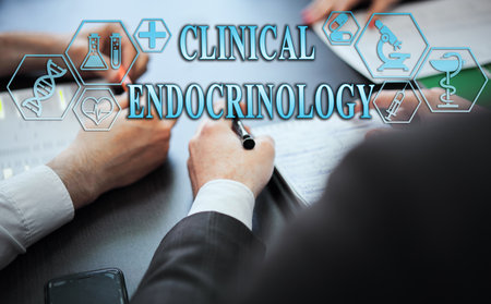 Medical healthcare concept - group of doctors in hospital with digital medical icons, graphic banner showing symbol of medicine, providing medical care. The inscription "CLINICAL ENDOCRINOLOGY"の写真素材