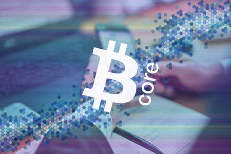Bitcore, BTX cryptocurrency sign. Business person, trader, investor, analyst using mobile phone app...